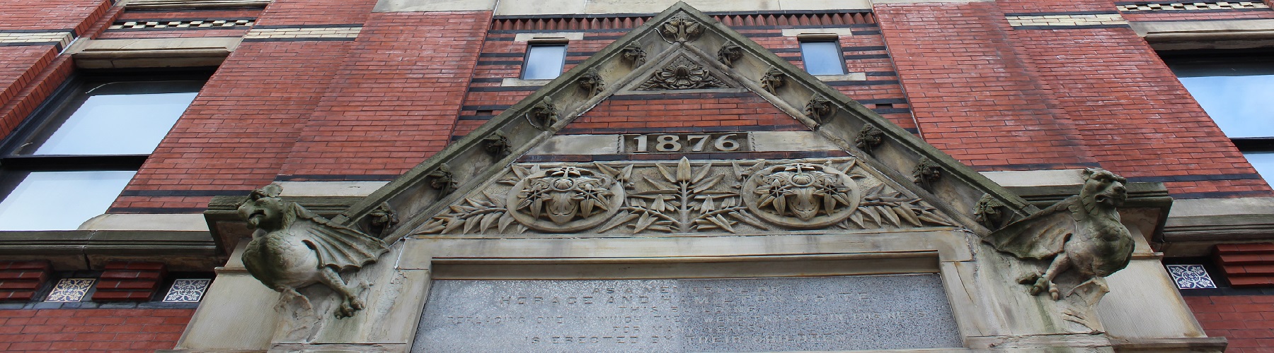 Building front with 1876 in the stonework
